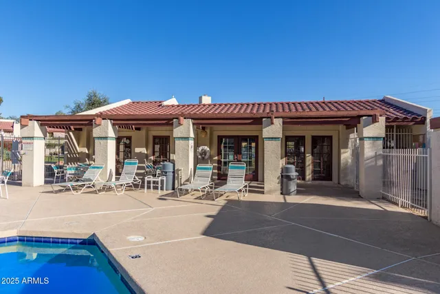 a swimming pool view with a outdoor seating
