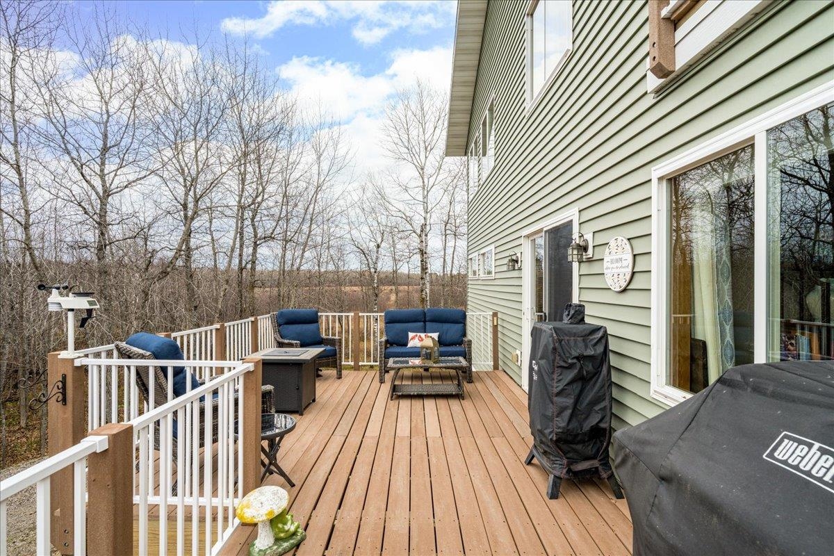 5224 Falcon Drive Hermantown, MN 55811 - Photo 8 of 48 Wooden deck featuring an outdoor living space and a grill