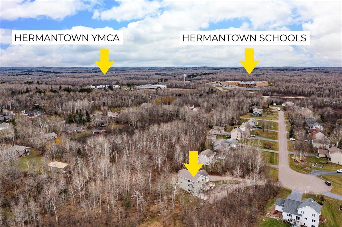 5224 Falcon Drive Hermantown, MN 55811 - Photo 9 of 48 Aerial overview of property's location with a forest and nearby suburban area