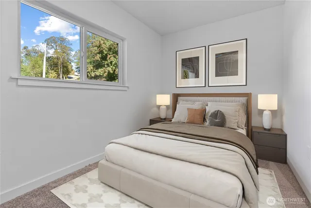 a bedroom with a bed and a window