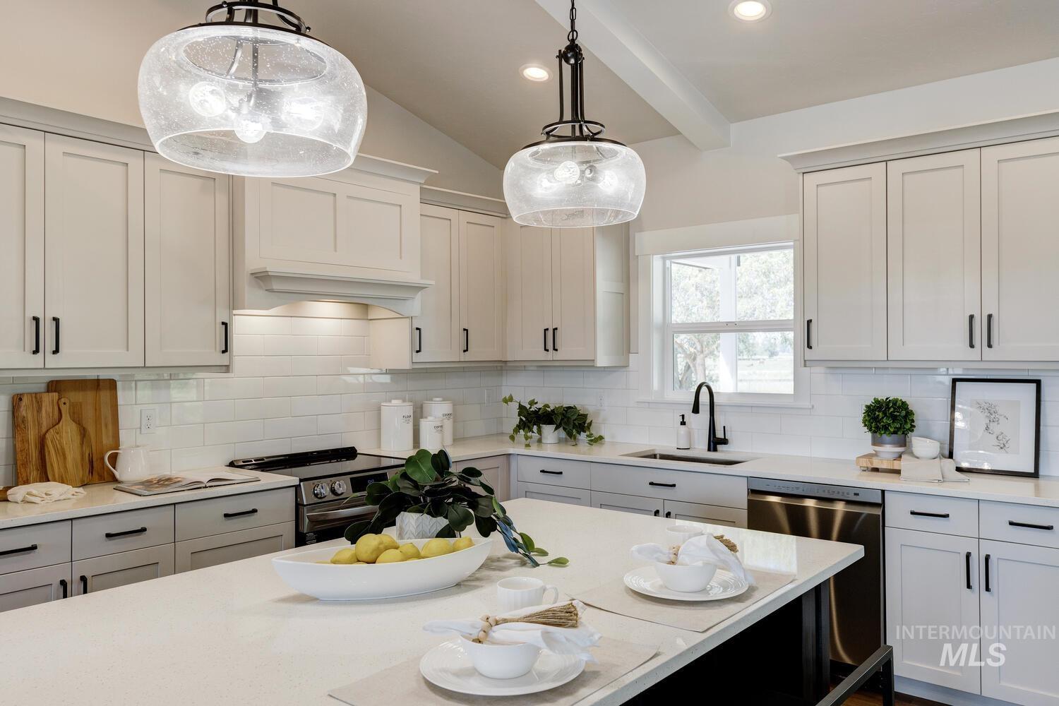 4695 County Line Road New Plymouth, ID 83655 - Photo 13 of 49 Kitchen featuring light countertops, appliances with stainless steel finishes, hanging light fixtures, tasteful backsplash, and recessed lighting
