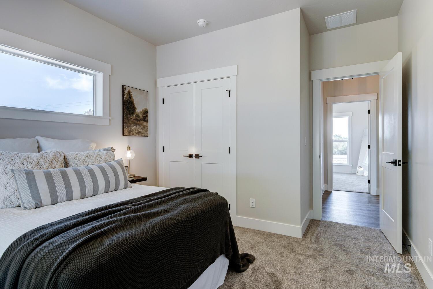 4695 County Line Road New Plymouth, ID 83655 - Photo 31 of 49 Bedroom with light carpet and a closet