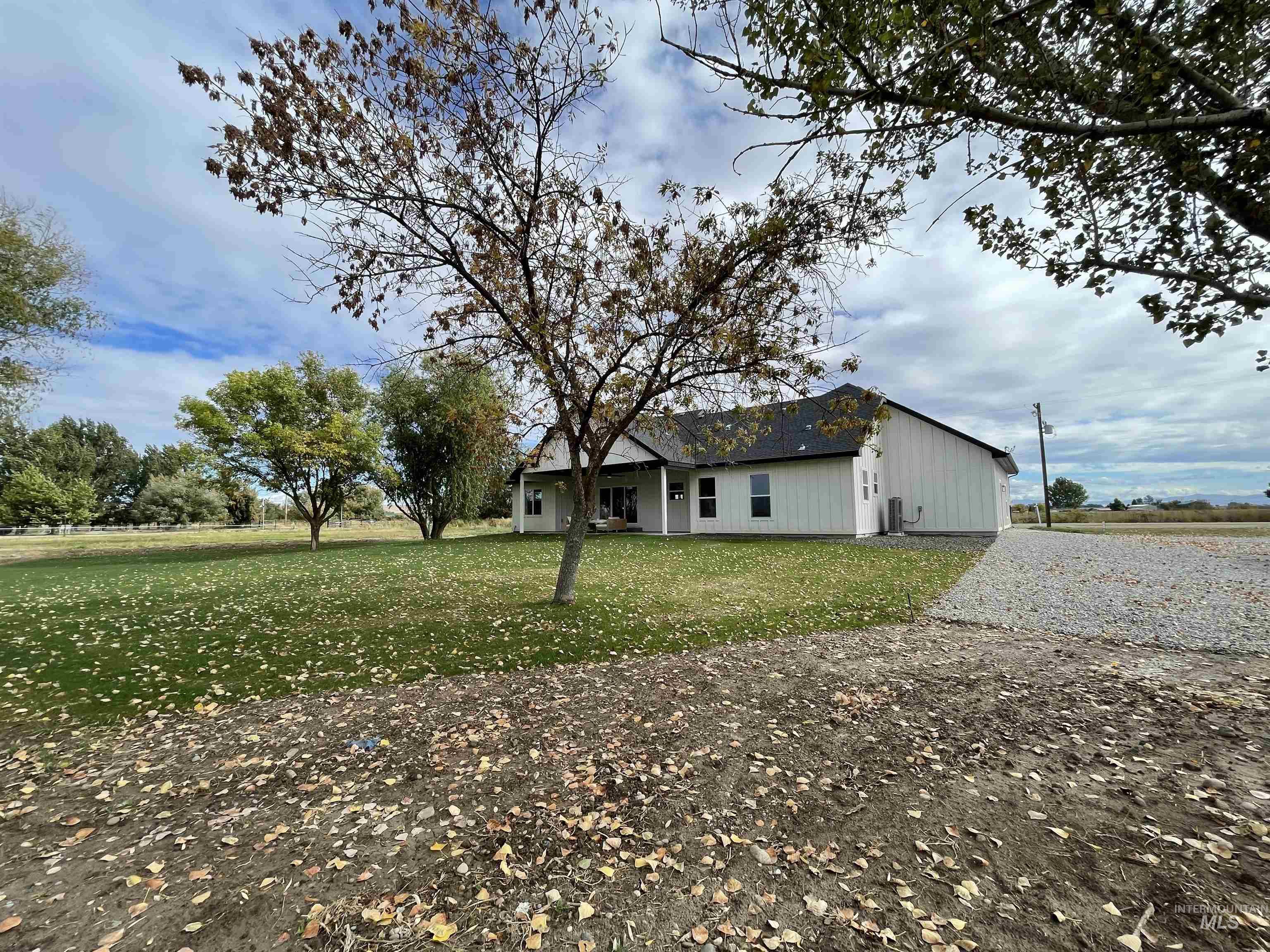 4695 County Line Road New Plymouth, ID 83655 - Photo 34 of 49 View of property exterior featuring a yard and a patio