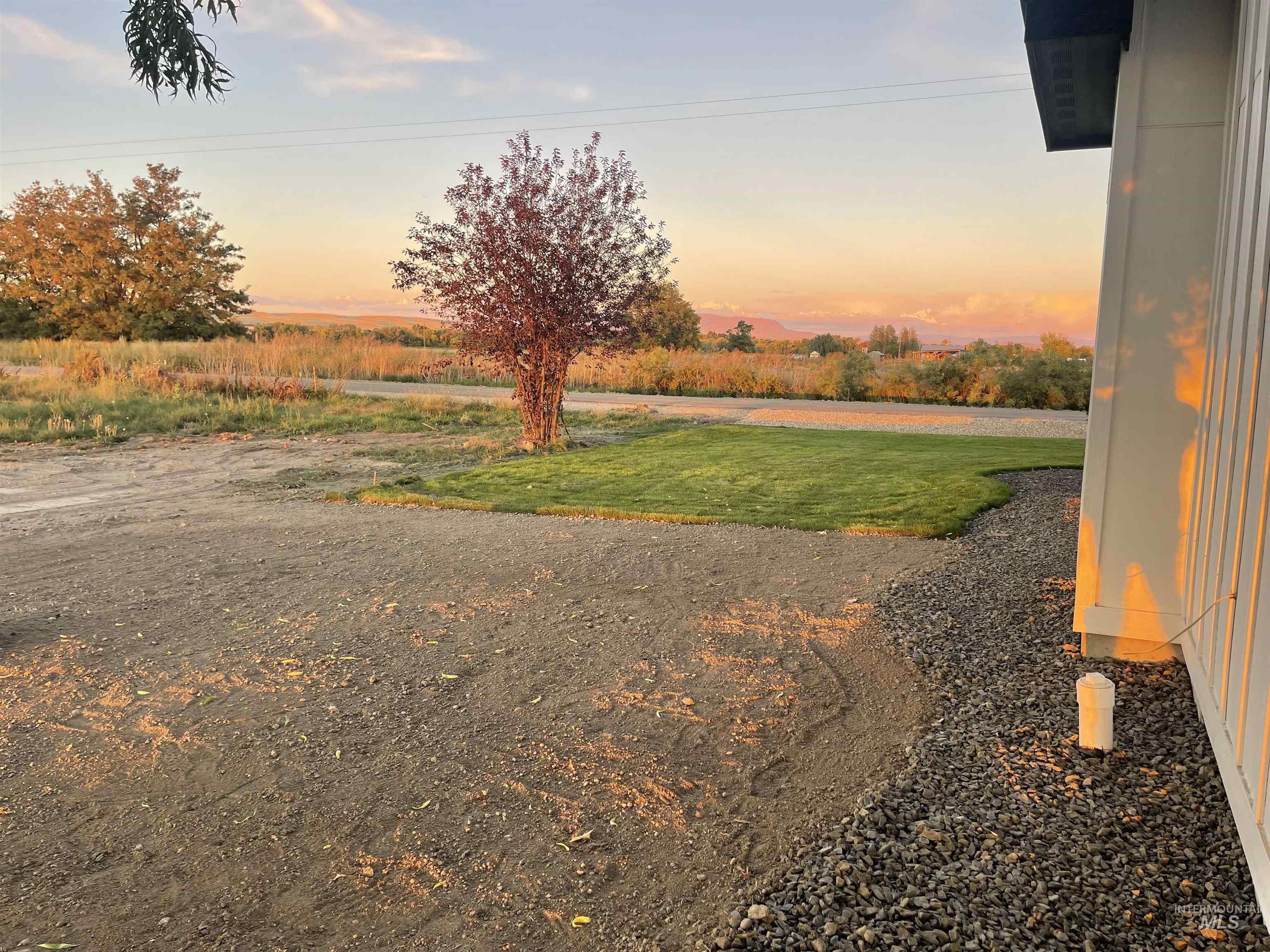 4695 County Line Road New Plymouth, ID 83655 - Photo 43 of 49 Yard at dusk featuring a yard