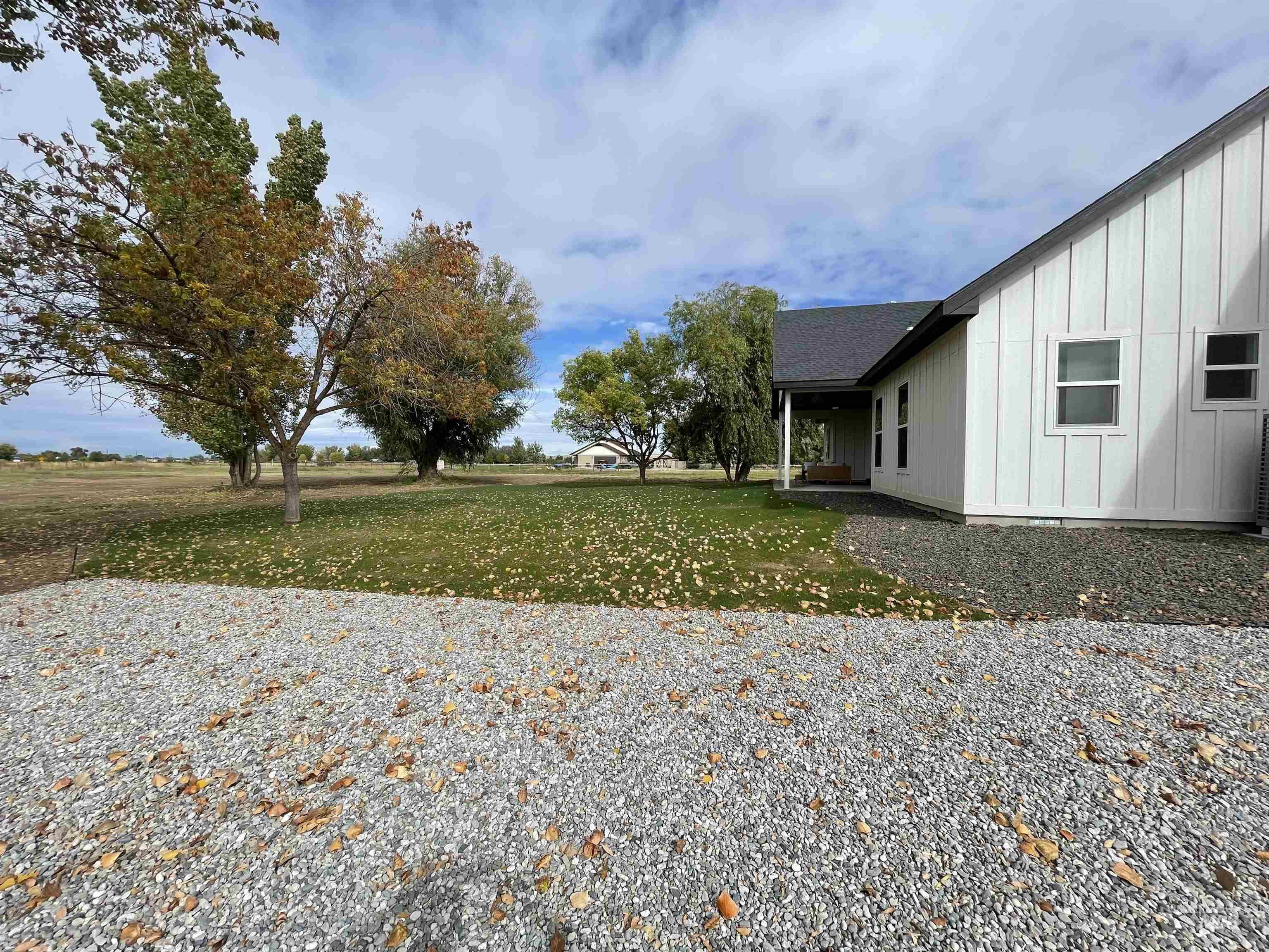 4695 County Line Road New Plymouth, ID 83655 - Photo 5 of 49 View of green lawn with a patio area
