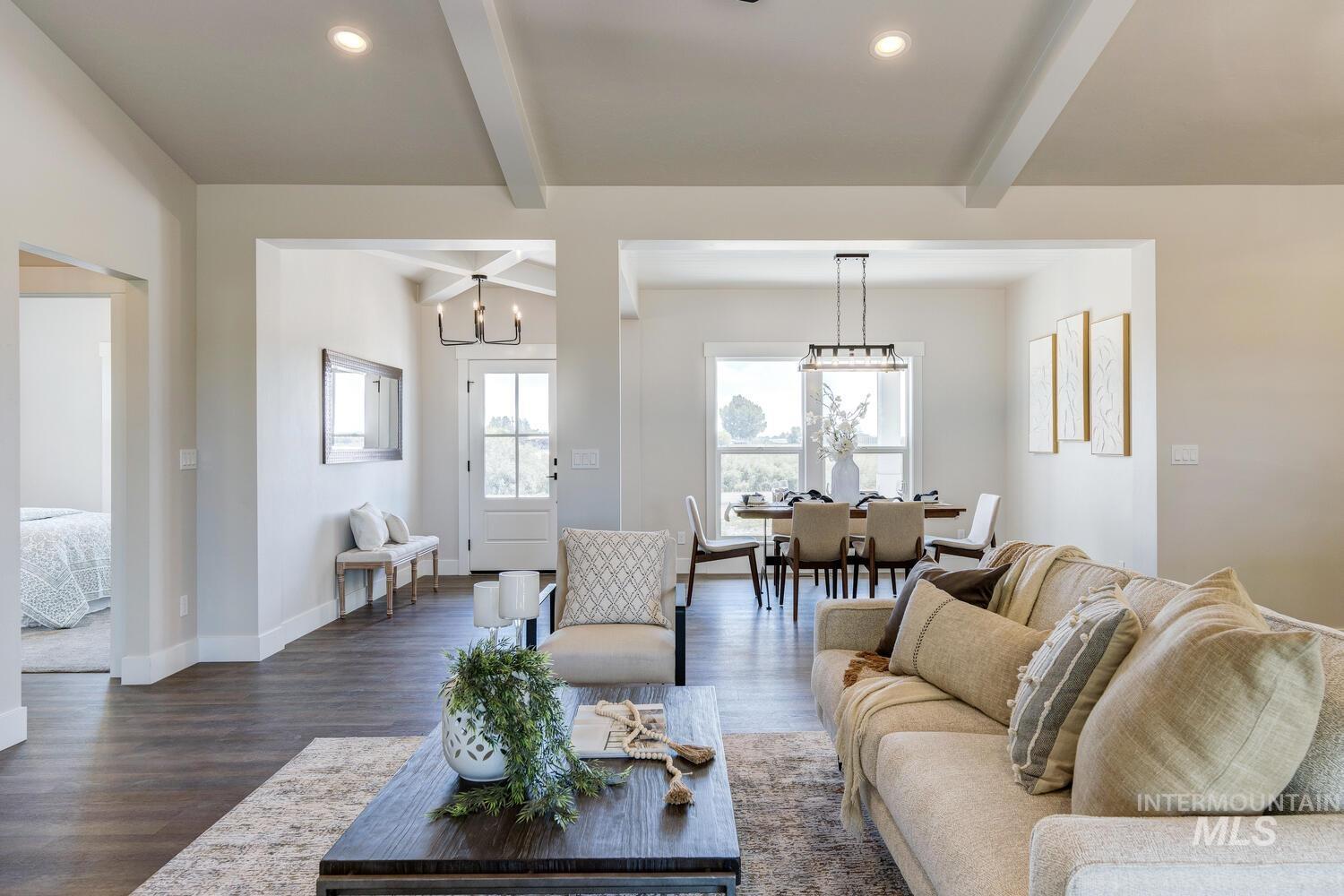 4695 County Line Road New Plymouth, ID 83655 - Photo 9 of 49 Living room featuring dark wood-style flooring, beam ceiling, recessed lighting, and a chandelier