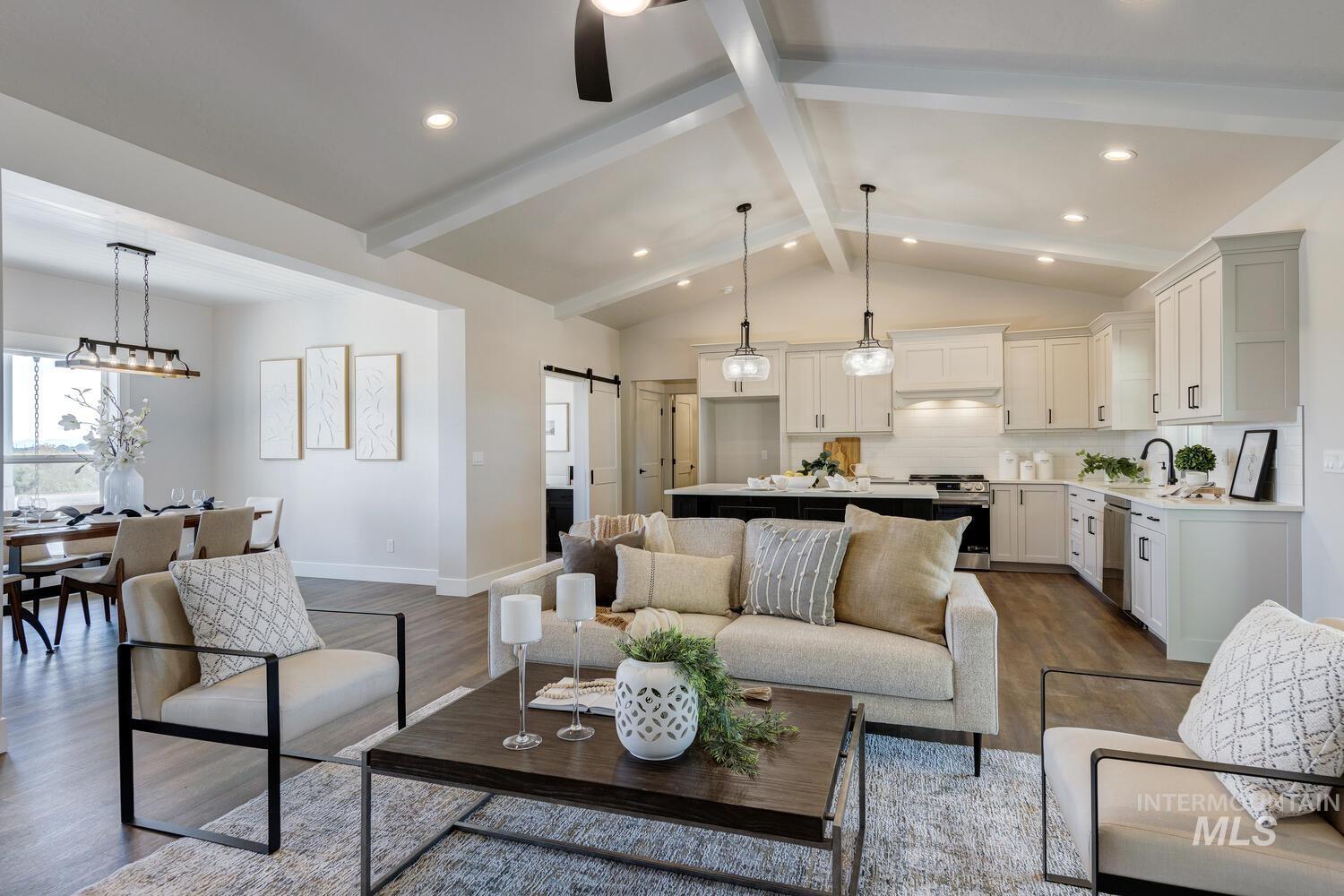 4695 County Line Road New Plymouth, ID 83655 - Photo 10 of 49 Living room with a barn door, dark wood-style floors, and recessed lighting