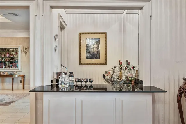 a kitchen with stainless steel appliances granite countertop a stove and cabinets