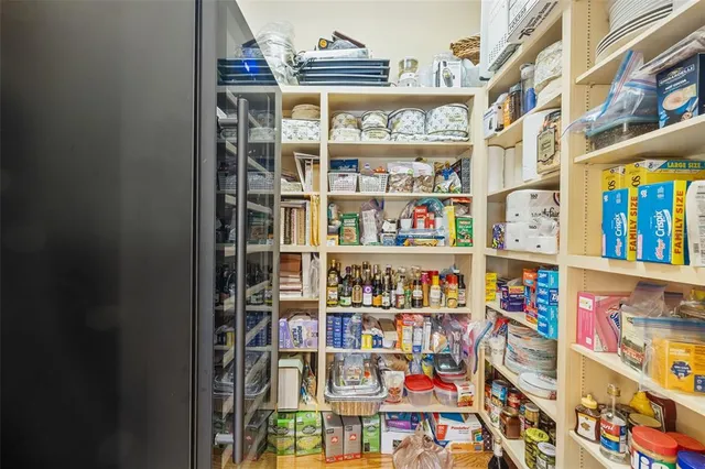 a bedroom with furniture and a mirror