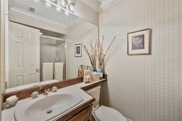 a view of walk in closet with clothes