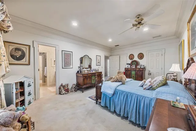 a view of a hallway with a livingroom and a dinning room with furniture