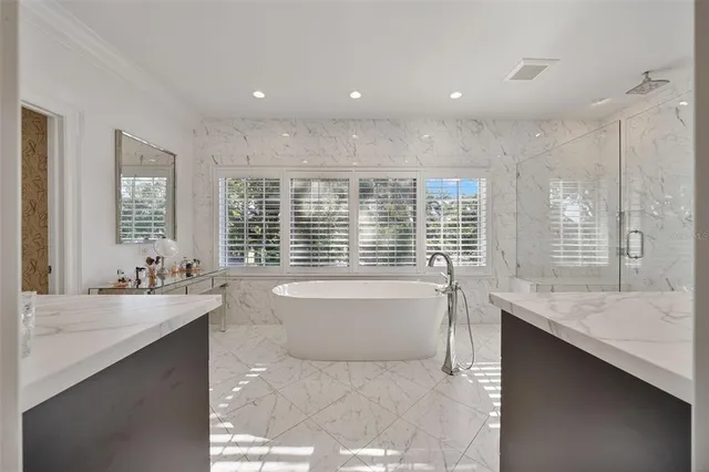 a bathroom with a sink mirror and toilet