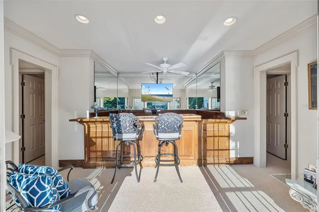 a bathroom with a sink a toilet and a large mirror