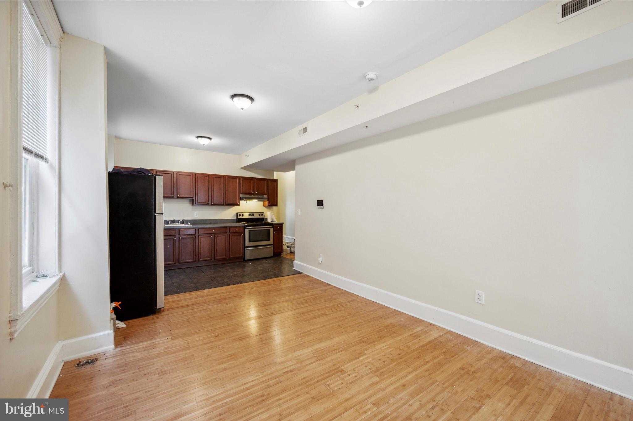 413 North Preston Street Philadelphia, PA 19104 - Photo 11 of 15 a view of a kitchen with wooden floor