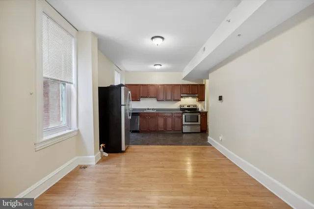 a view of kitchen with wooden floor