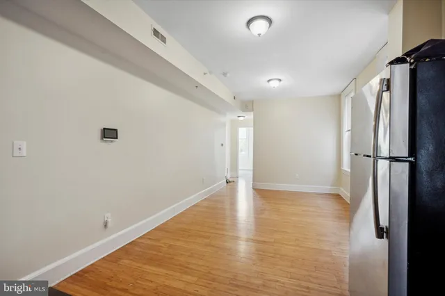 a view of a livingroom with wooden floor