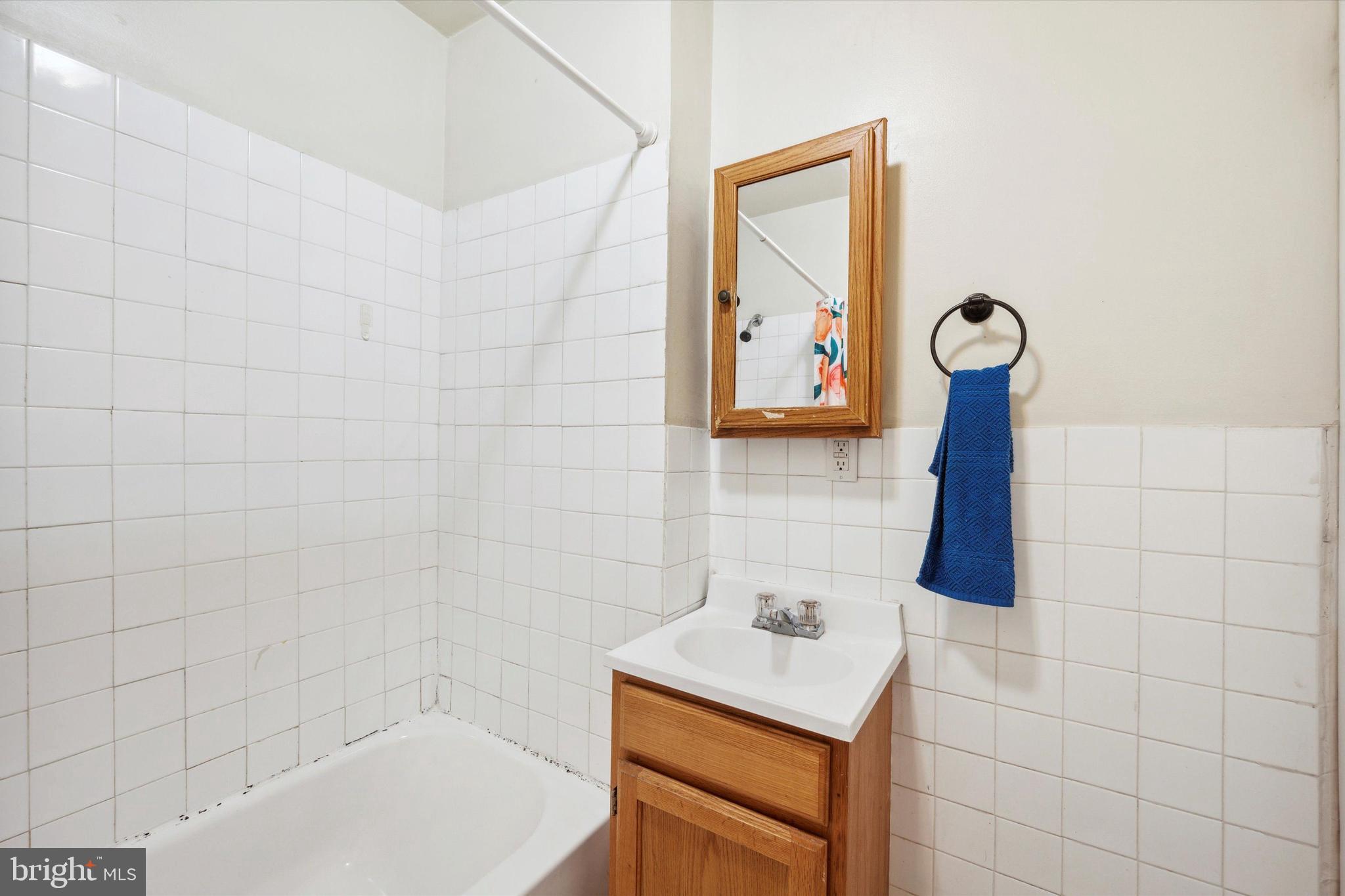 413 North Preston Street Philadelphia, PA 19104 - Photo 5 of 15 a bathroom with a sink a toilet and a shower