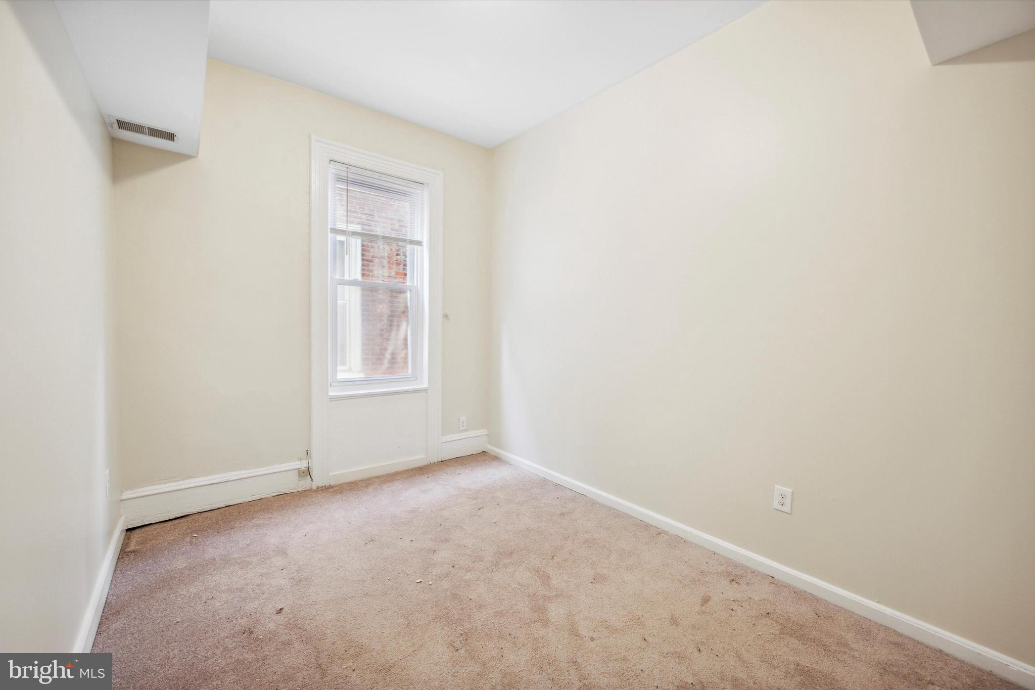 413 North Preston Street Philadelphia, PA 19104 - Photo 6 of 15 a view of an empty room with a window