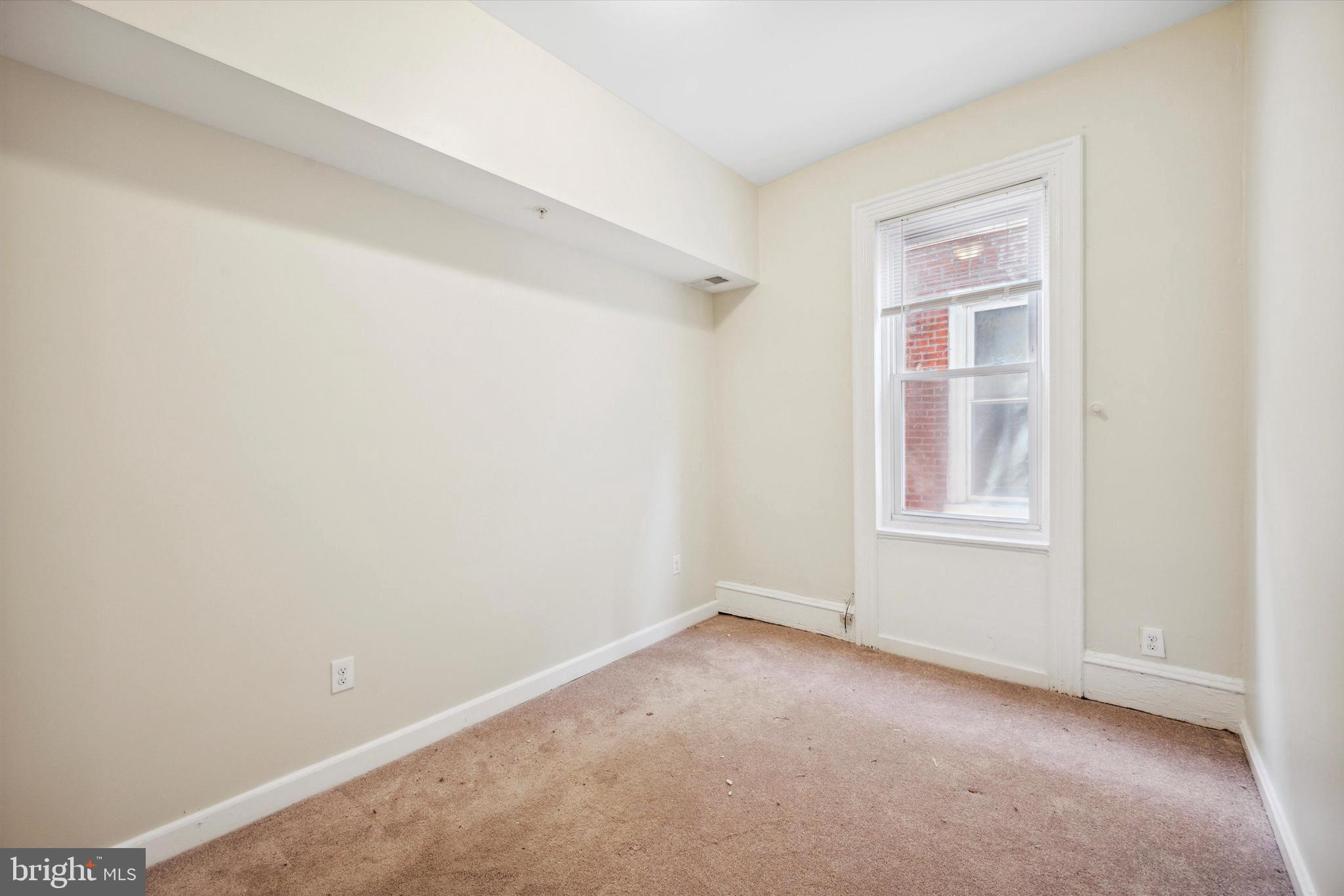 413 North Preston Street Philadelphia, PA 19104 - Photo 7 of 15 a view of an empty room with a window