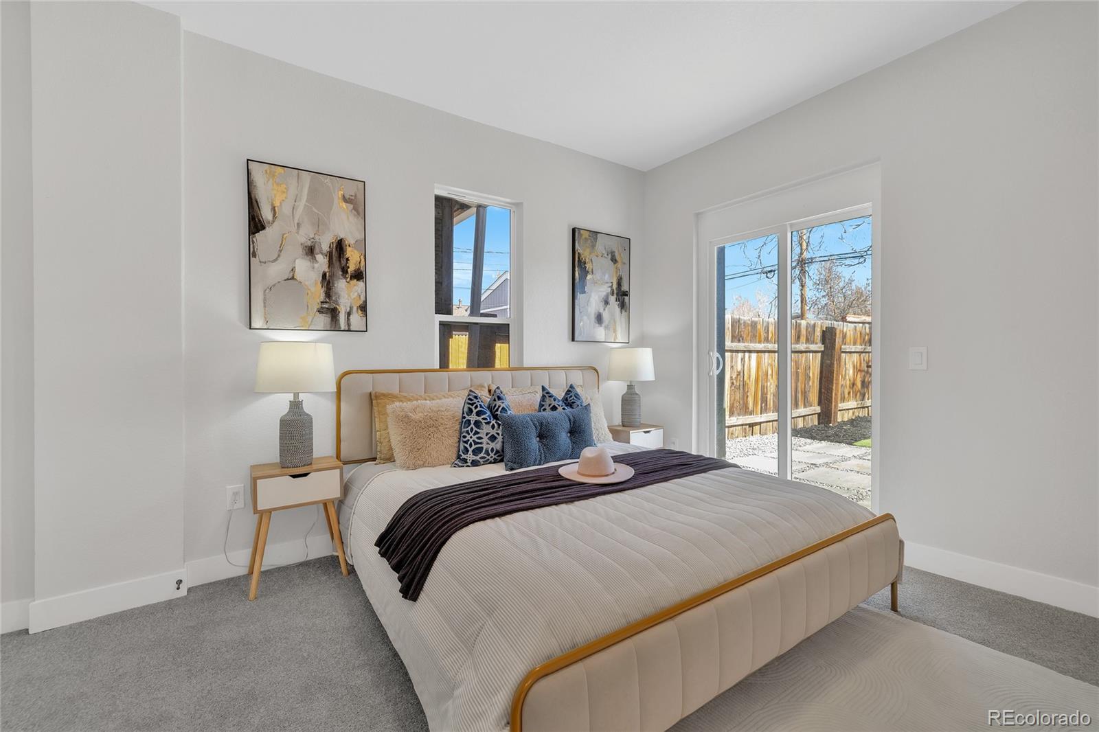 3512 High Street Denver, CO 80205 - Photo 13 of 33 a bedroom with a bed and a window