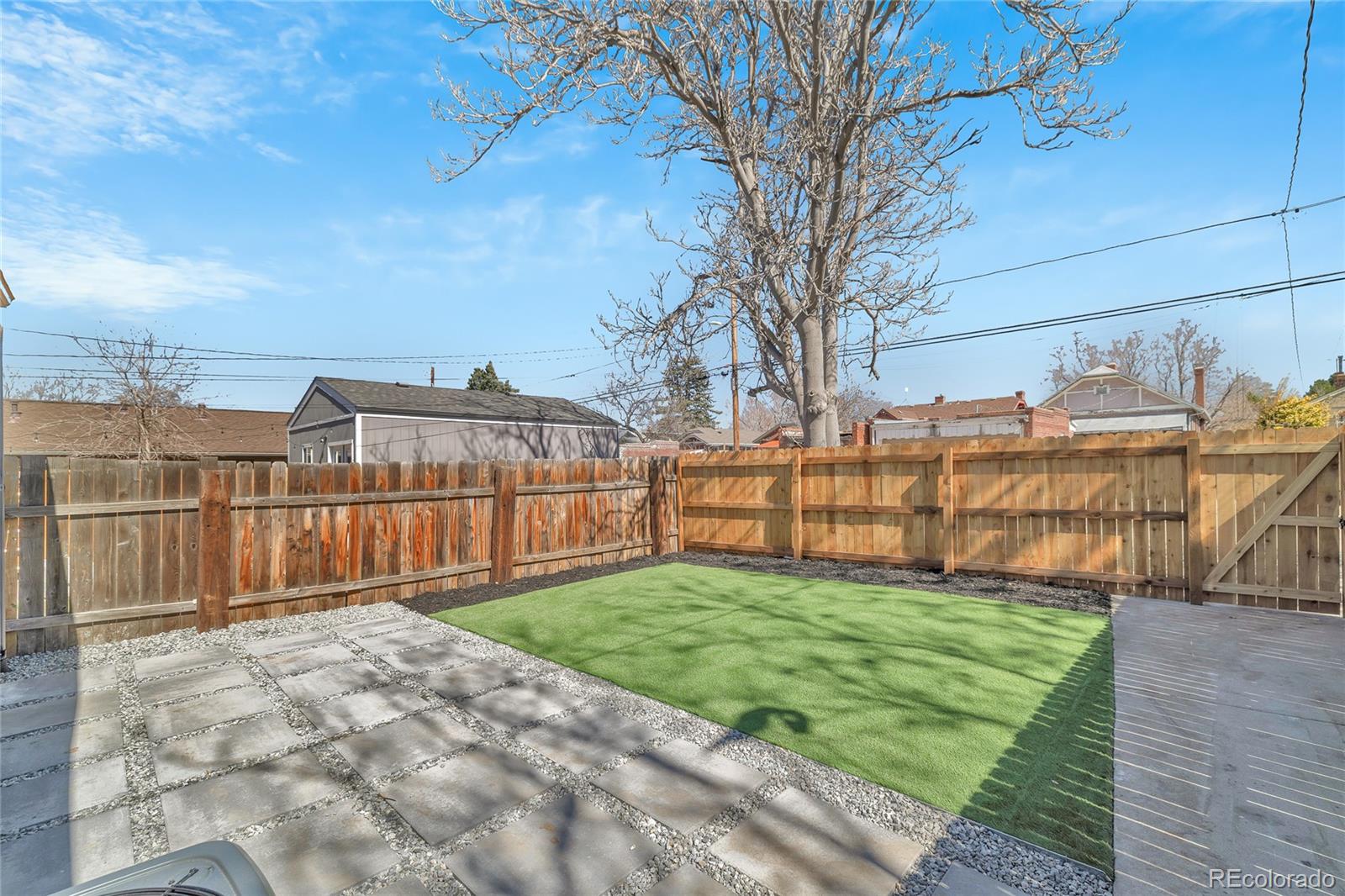 3512 High Street Denver, CO 80205 - Photo 27 of 33 a view of a backyard with wooden fence