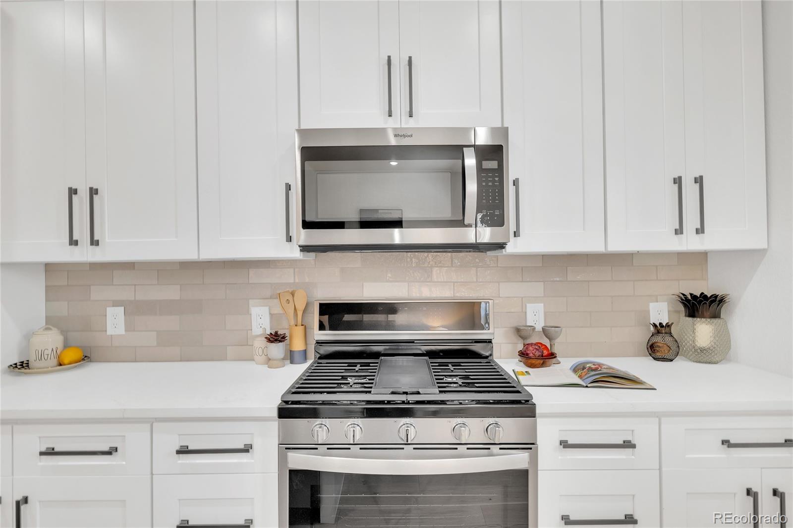 3512 High Street Denver, CO 80205 - Photo 9 of 33 a stove top oven sitting inside of a kitchen