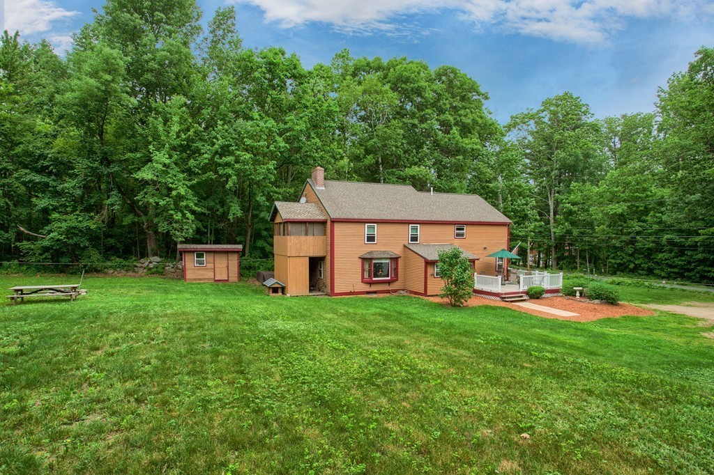 99 Mirick Road Princeton, MA 01541 - Photo 6 of 30 a aerial view of a house with swimming pool and garden