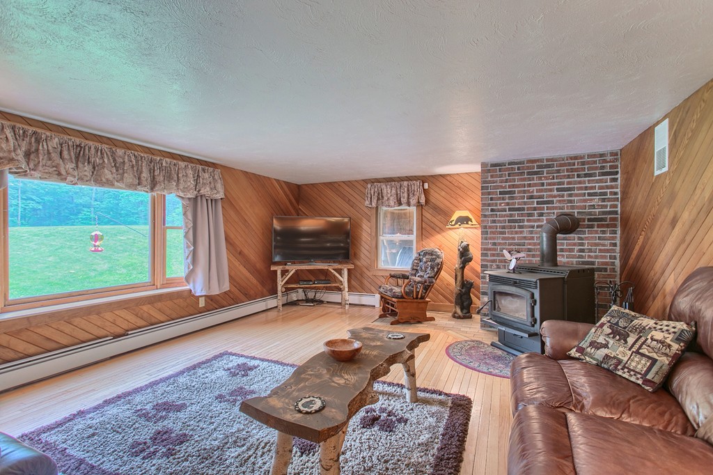 99 Mirick Road Princeton, MA 01541 - Photo 8 of 30 a living room with furniture and a large window