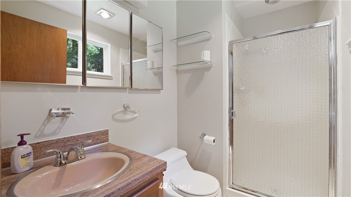 23403 Locust Way Bothell, WA 98021 - Photo 22 of 35 a bathroom with a sink toilet and shower