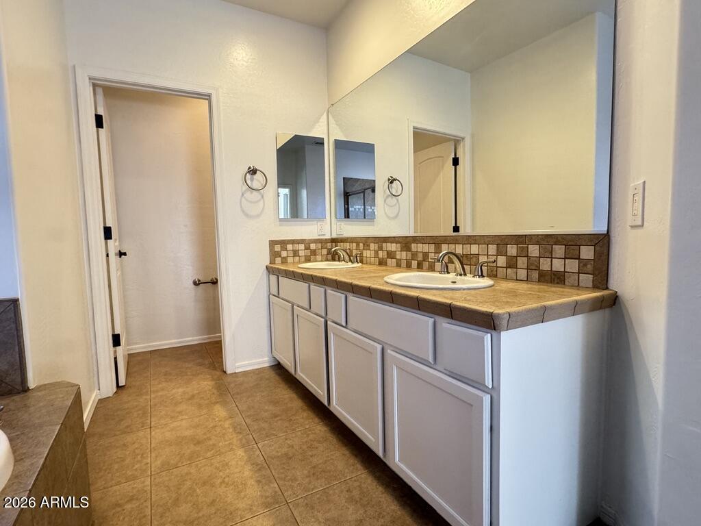 2611 North 48th Street, Unit 4 Phoenix, AZ 85008 - Photo 14 of 23 a bathroom with a sink and a mirror