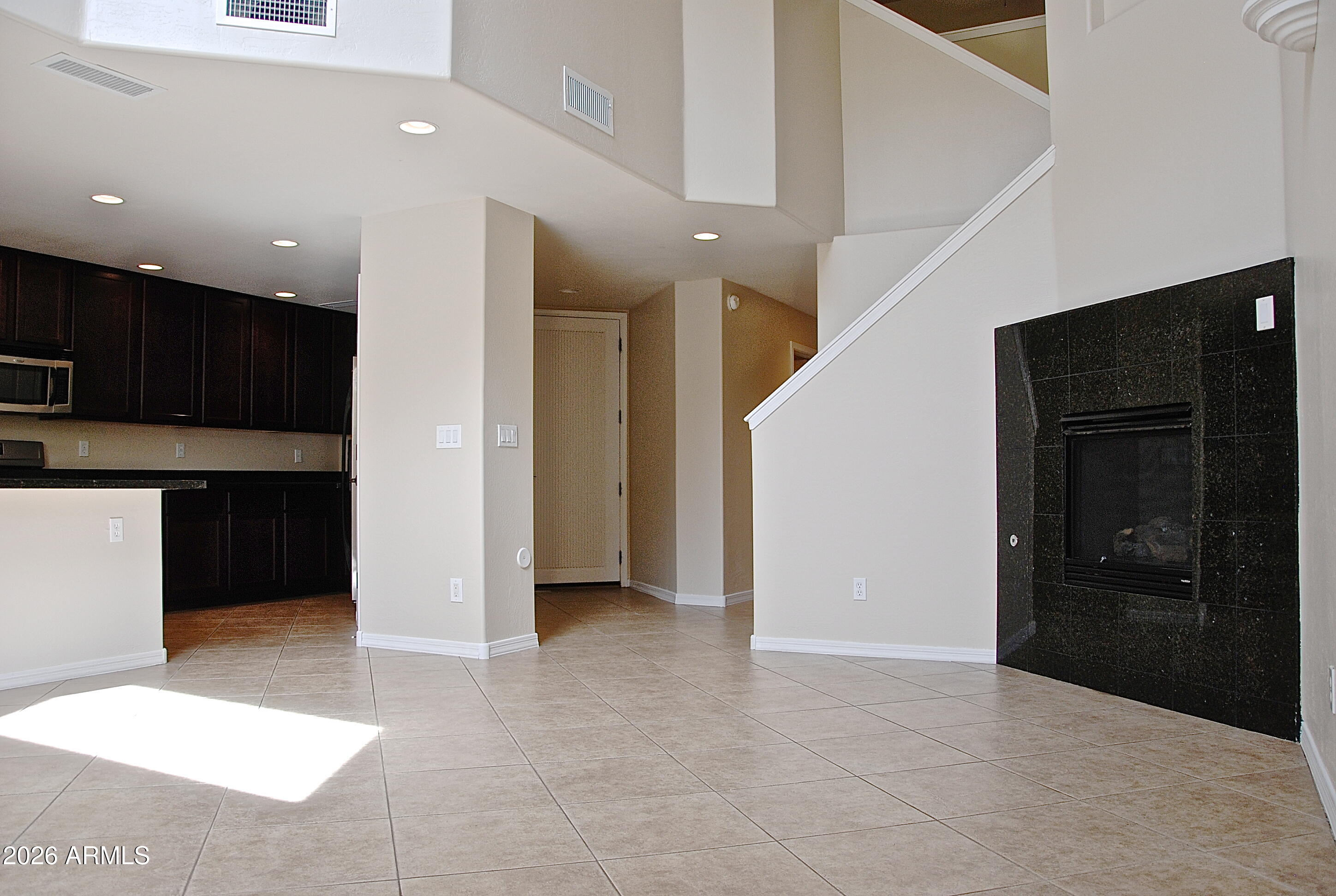 2611 North 48th Street, Unit 4 Phoenix, AZ 85008 - Photo 6 of 23 a view of a kitchen with kitchen island granite countertop refrigerator and sink
