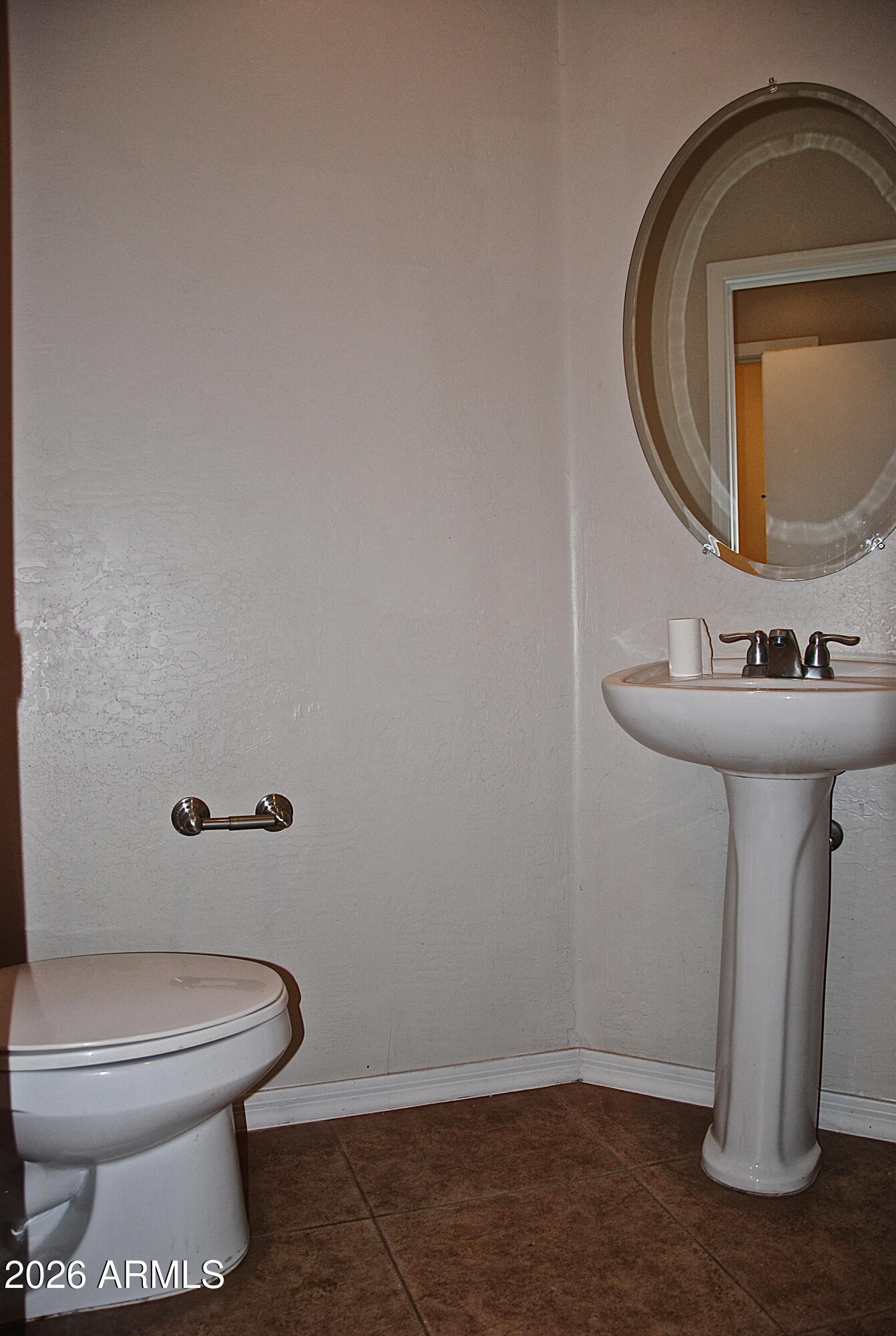 2611 North 48th Street, Unit 4 Phoenix, AZ 85008 - Photo 8 of 23 a bathroom with a toilet sink and mirror