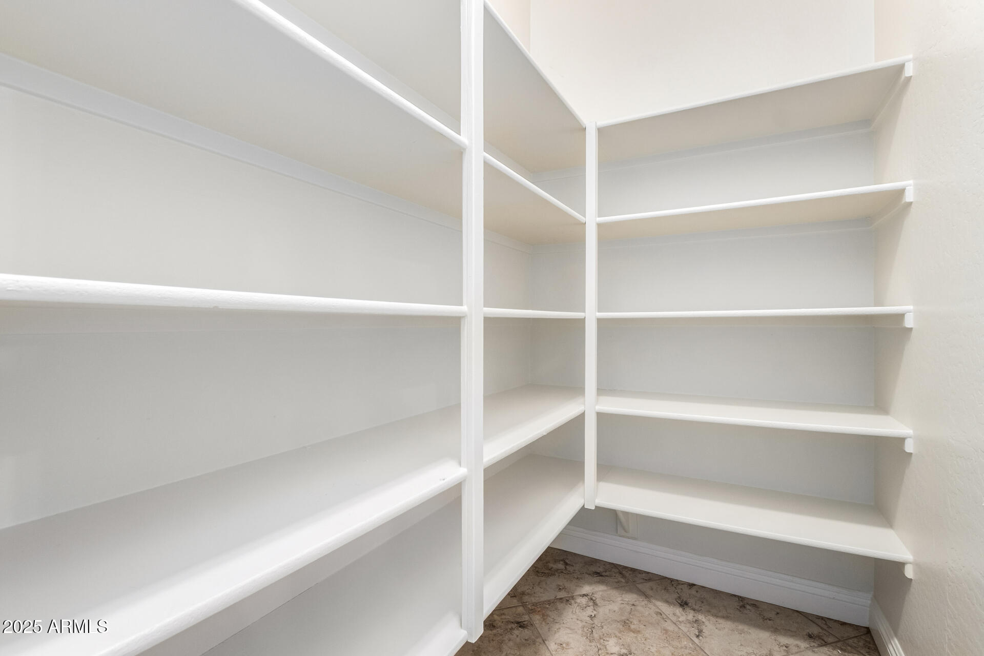 19263 East Estrella Road Queen Creek, AZ 85142 - Photo 12 of 53 a view of walk in closet with empty racks