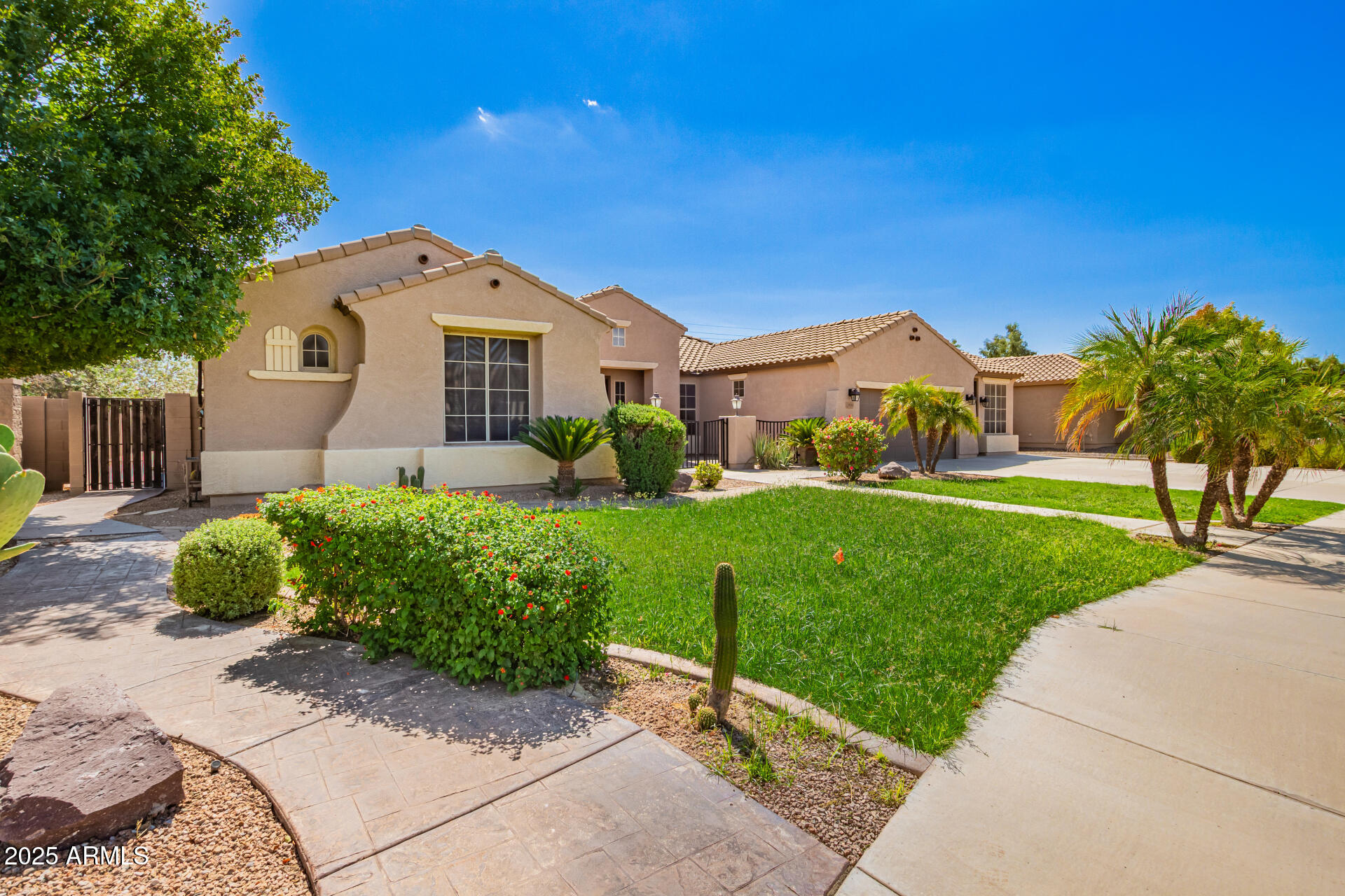 19263 East Estrella Road Queen Creek, AZ 85142 - Photo 2 of 53 a front view of a house with a yard