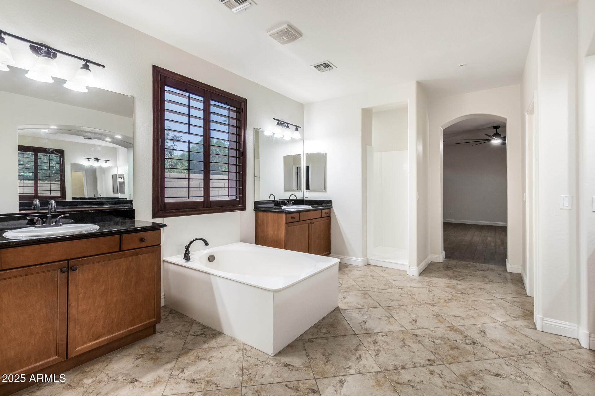 19263 East Estrella Road Queen Creek, AZ 85142 - Photo 21 of 53 a large white room with a large window and stainless steel appliances