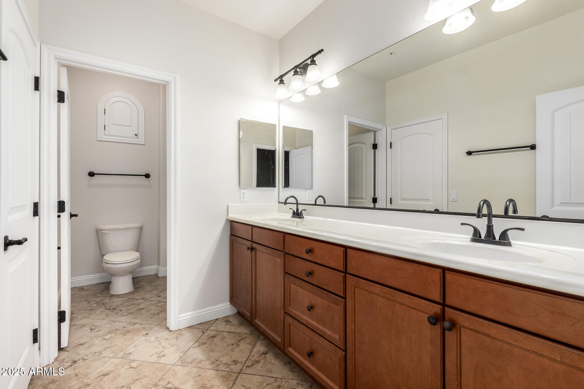 19263 East Estrella Road Queen Creek, AZ 85142 - Photo 32 of 53 a spacious bathroom with a double vanity sink mirror and toilet