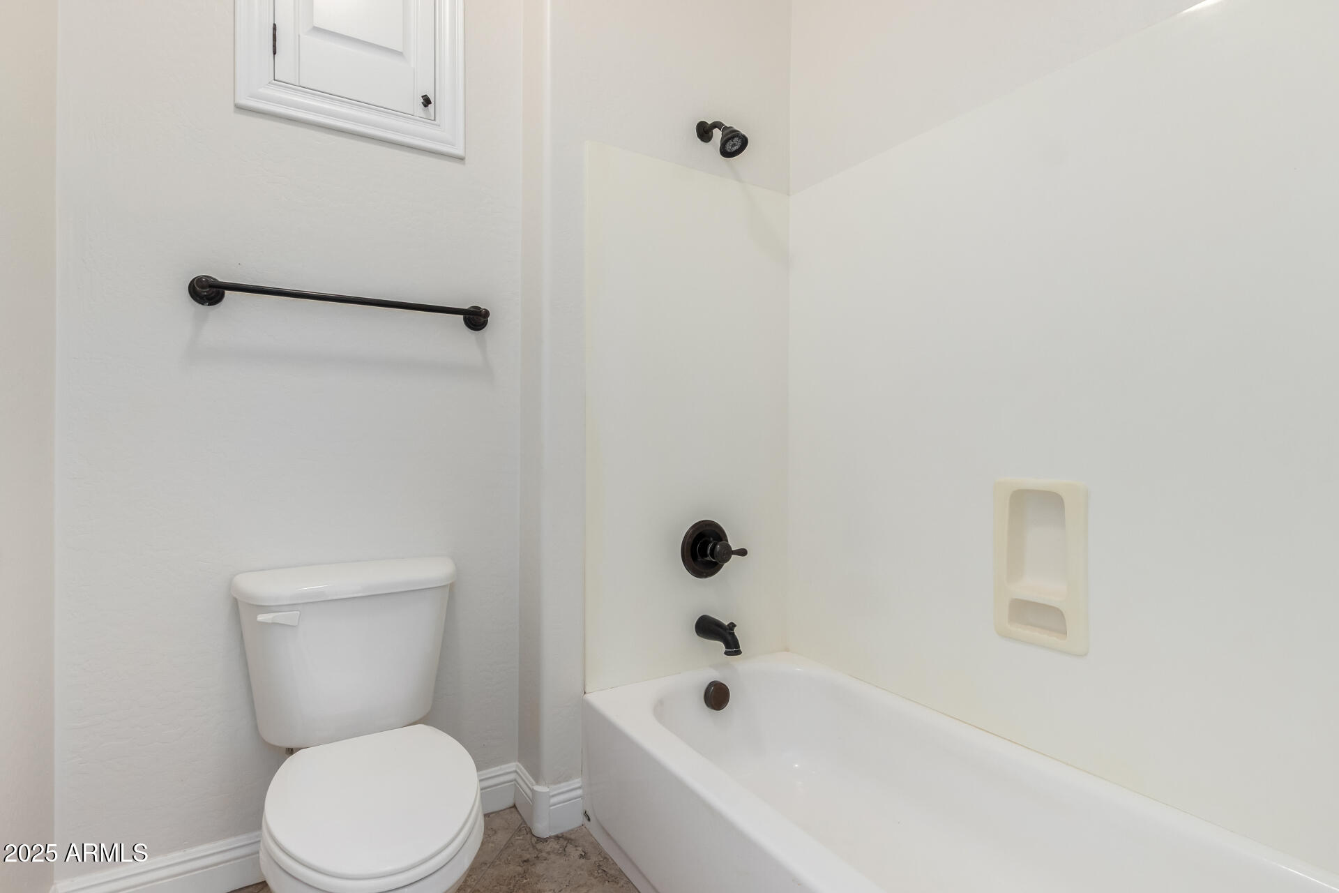 19263 East Estrella Road Queen Creek, AZ 85142 - Photo 33 of 53 a white toilet sitting next to a bath tub