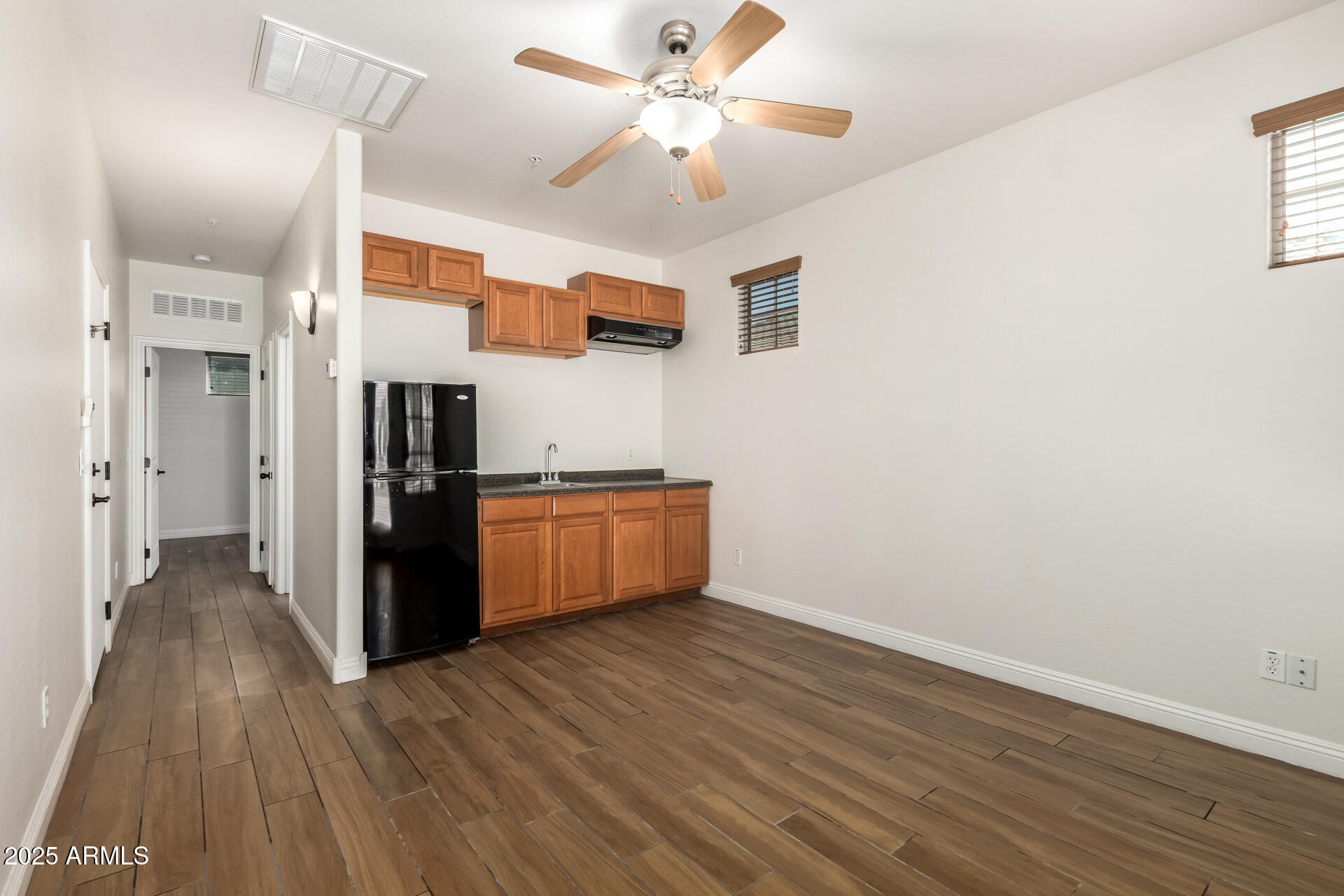 19263 East Estrella Road Queen Creek, AZ 85142 - Photo 41 of 53 a view of kitchen with wooden floor electronic appliances and window
