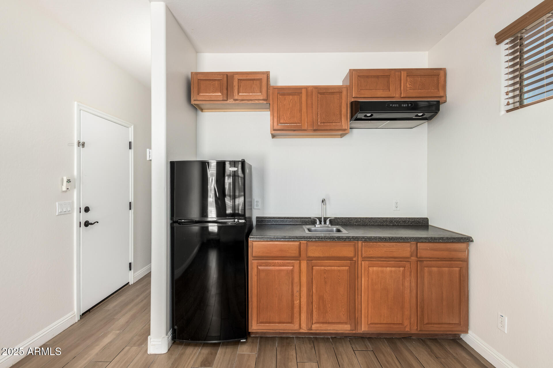 19263 East Estrella Road Queen Creek, AZ 85142 - Photo 42 of 53 a kitchen with stainless steel appliances granite countertop a refrigerator and a sink