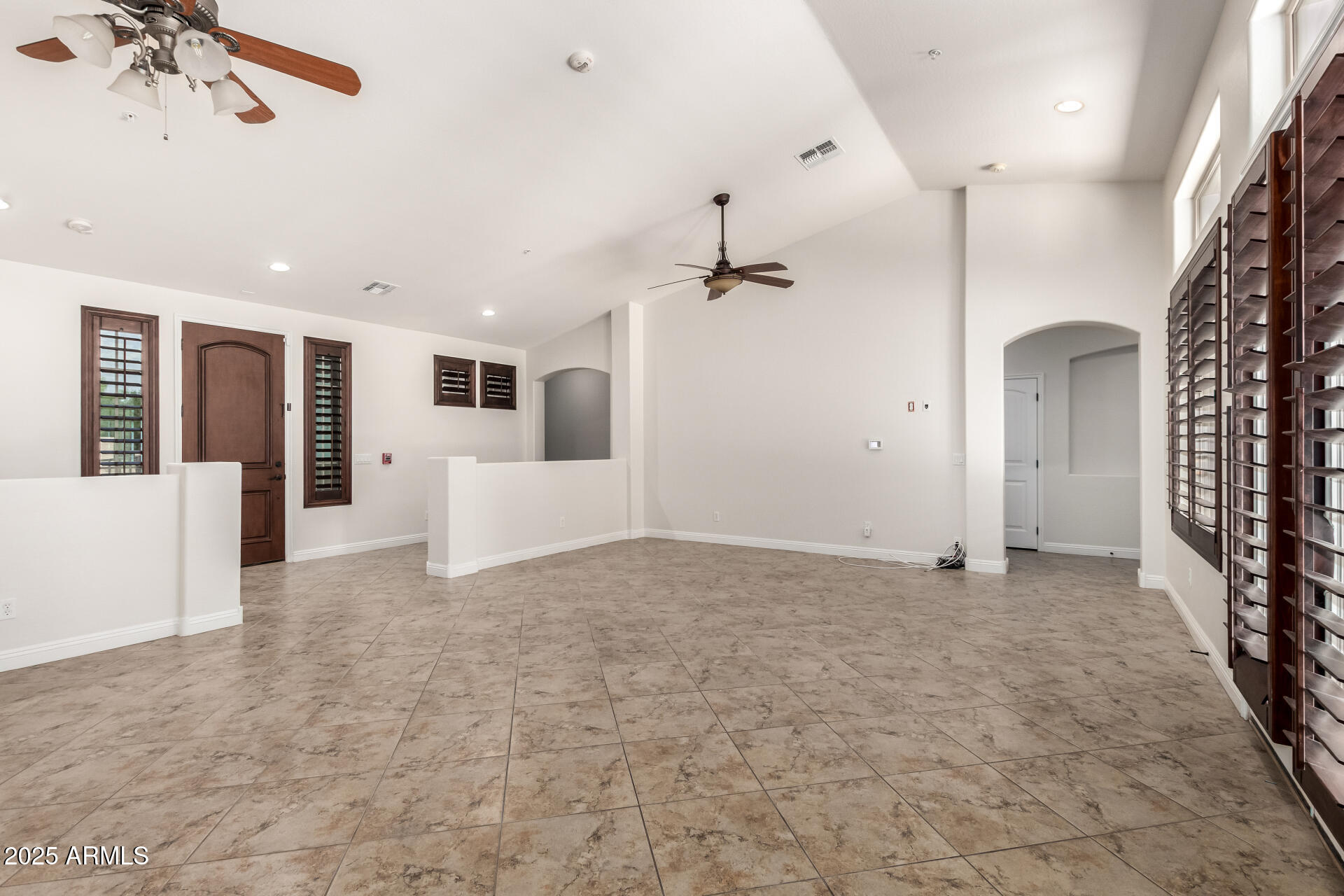 19263 East Estrella Road Queen Creek, AZ 85142 - Photo 6 of 53 a view of a livingroom with a ceiling fan