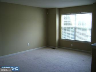 24 Hogan Way Moorestown, NJ 08057 - Photo 3 of 9 a view of an empty room with a window