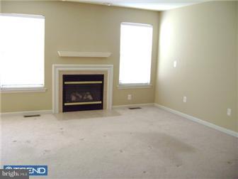 24 Hogan Way Moorestown, NJ 08057 - Photo 7 of 9 a view of an empty room with a fireplace