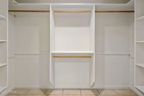 a bathroom with a double vanity sink mirror and shower