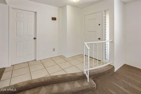 a view of a house with backyard and porch