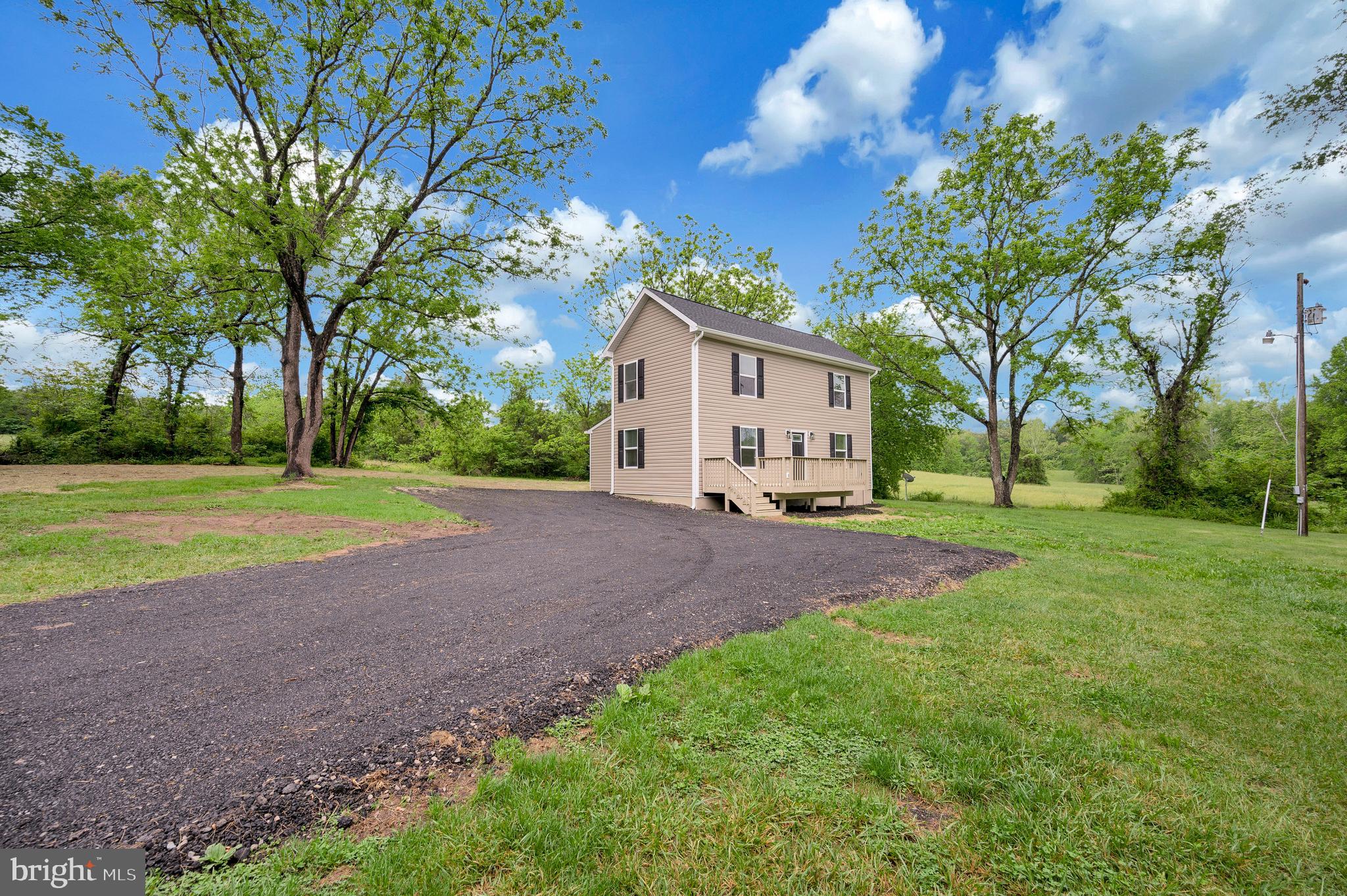 14169 Silver Hill Road Sumerduck, VA 22742 - Photo 31 of 40 a view of a house with a backyard