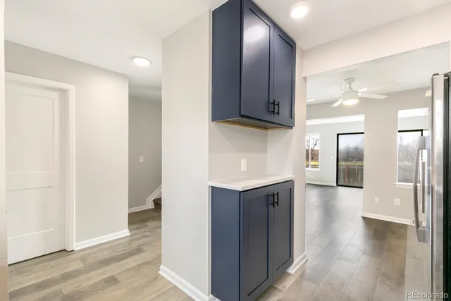 a kitchen with a sink stainless steel appliances and cabinets