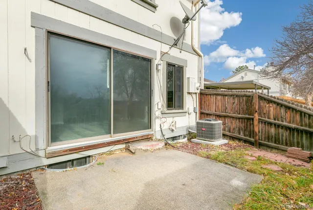 a view of a white house with a large windows