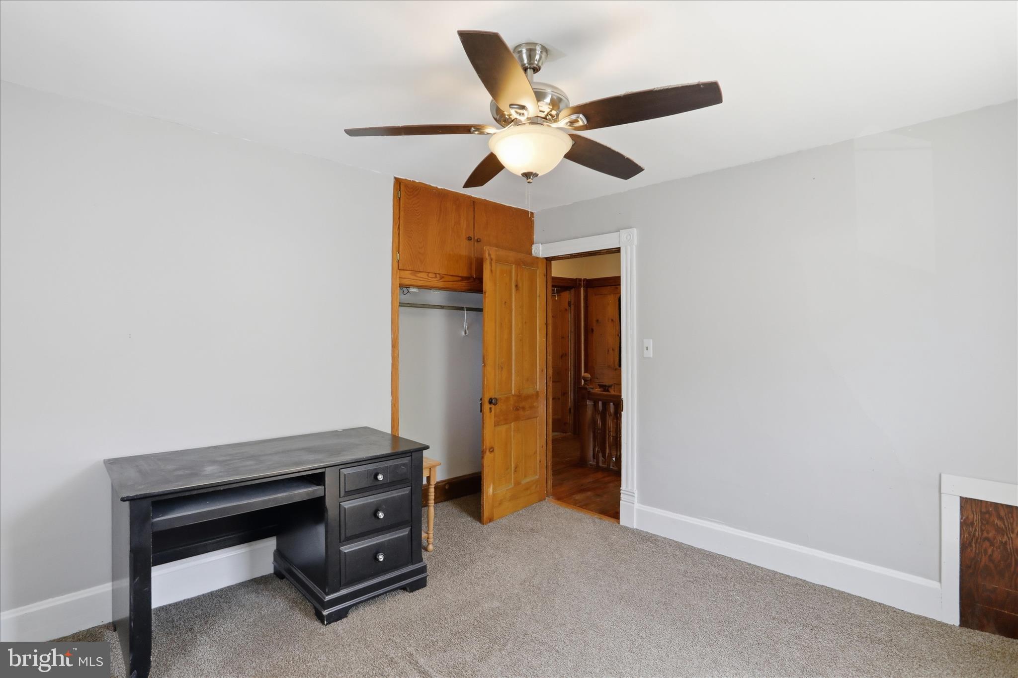 21 Sharpless Street Keyser, WV 26726 - Photo 25 of 33 a room with a piano and a ceiling fan