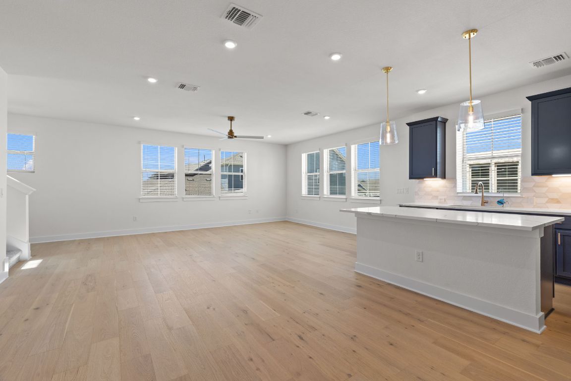 6312 Stockman Drive, Unit 6 Austin, TX 78747 - Photo 16 of 35 a view of an empty room with a window and wooden floor