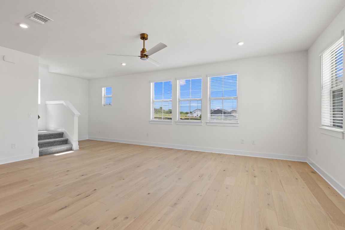 6312 Stockman Drive, Unit 6 Austin, TX 78747 - Photo 17 of 35 a view of an empty room with a window and kitchen area
